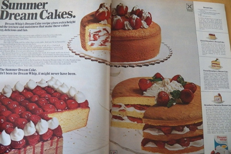 May include: An advertisement for Summer Dream Cakes featuring several cakes with strawberries and whipped cream. The text "Summer Dream Cakes" is at the top, with additional text describing the recipe and ingredients.
