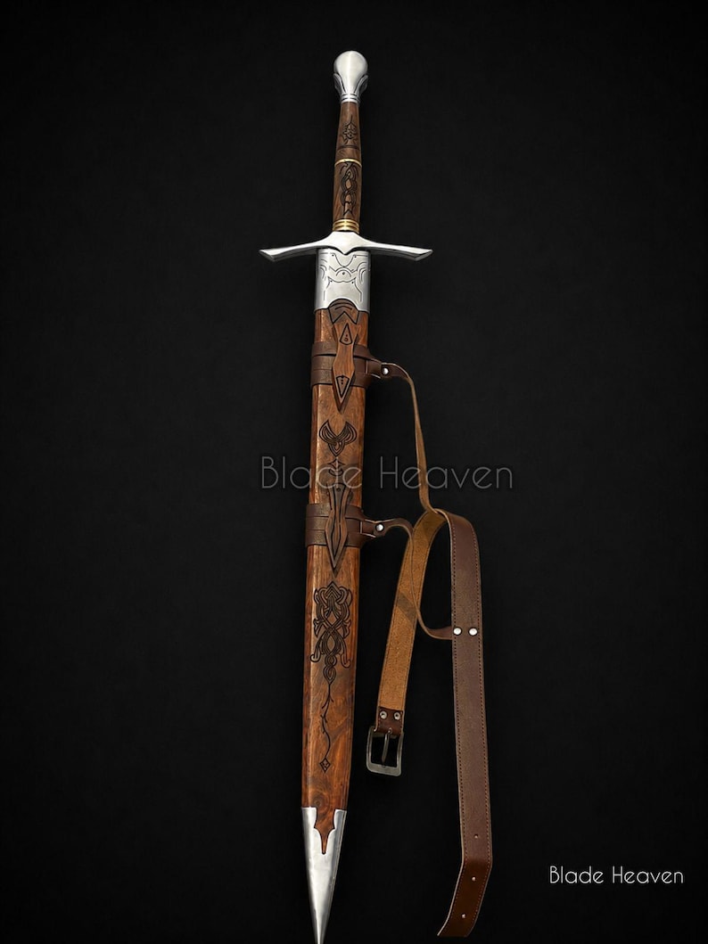 May include: A longsword with a silver pommel, crossguard, and metal throat, featuring a wooden grip and scabbard with intricate dark engravings. The scabbard includes a brown leather belt with a metal buckle. The text Blade Heaven is visible.