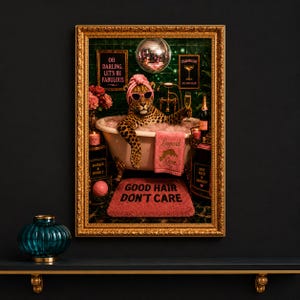 May include: A framed print featuring a leopard in a bathtub, wearing sunglasses and a pink head wrap. The artwork includes a disco ball, champagne, and the text "Good Hair Don't Care."