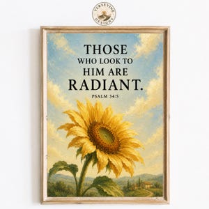 May include: A framed wall art print featuring a large yellow sunflower in a landscape with a blue sky and clouds. The text reads: THOSE WHO LOOK TO HIM ARE RADIANT. PSALM 34:5. The artwork has a textured, painterly style with visible brushstrokes.