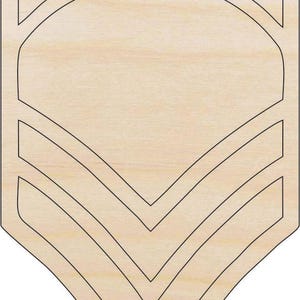 May include: Wooden military rank insignia, featuring a light wood grain background with black outline. The design includes curved lines at the top and chevron shapes at the bottom, creating a classic military emblem.