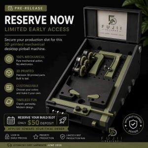 May include: A 3D printed mechanical desktop pinball machine in black and olive green. The image includes text that says "Reserve Now" and "Fujii Designs". The machine is 100% mechanical and customizable.