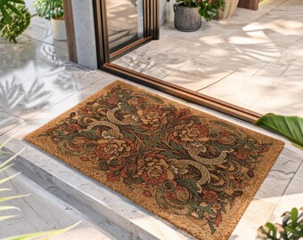 Puede incluir: Una alfombra rectangular con un intrincado diseño floral en tonos marrones, naranjas y verdes. El patrón presenta flores estilizadas y vides onduladas, creando una pieza decorativa para la entrada. La alfombra está hecha de un material de fibra natural.