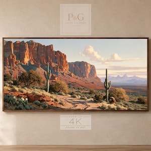 May include: A panoramic landscape wall art print featuring a desert scene with towering red rock formations, scattered saguaro cacti, and low-lying desert shrubs under a clear sky. The artwork displays a natural terrain with earthy tones.