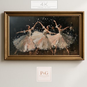 May include: A framed horizontal wall art print depicting three ballet dancers in white tutus performing on a dark stage. The dancers are captured in motion with light-colored skirts and delicate details. The frame is a metallic gold color.