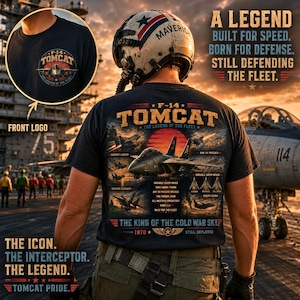 May include: A black t-shirt featuring a large graphic on the back of an F-14 Tomcat fighter jet with text detailing its history and specifications. A smaller circular F-14 Tomcat logo is printed on the front chest area of the garment.
