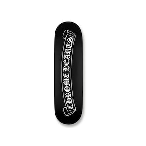 May include: Black skateboard with the text "CHROME HEARTS" in white, stylized lettering. The text is displayed on a white banner. The skateboard has a rounded shape.