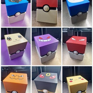 May include: Nine cube-shaped boxes with character designs in various colours. Each box has a character face on top and a button on the bottom. The boxes are in colours such as blue, red, purple, and yellow. The boxes are designed to look like a Poké Ball.