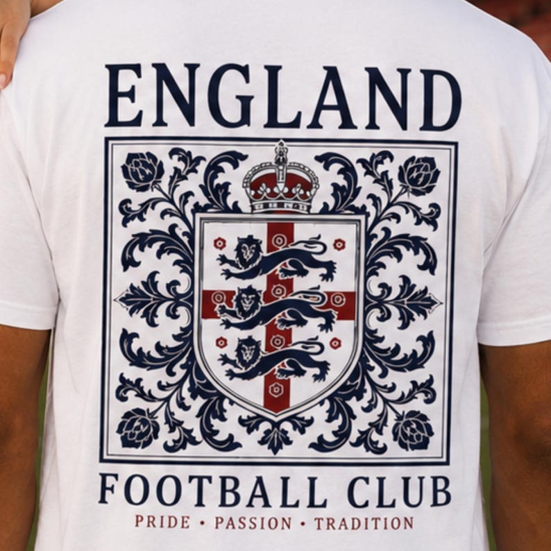 A close-up of the back of a white t-shirt featuring a large England Football Club crest.