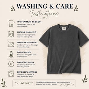 May include: A charcoal gray short-sleeved t-shirt displayed next to a list of washing and care instructions. The text includes: WASHING & CARE Instructions, TURN GARMENT INSIDE OUT, MACHINE WASH COLD, DO NOT IRON ON PRINT, DO NOT BLEACH, DO NOT DRY CLEAN, DRY ON LOW SETTINGS, LOVE YOUR TEE.