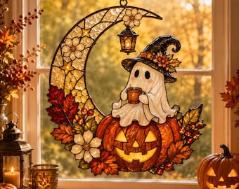 May include: A stained glass suncatcher shaped like a crescent moon featuring a white ghost wearing a witch hat and holding a mug, sitting atop a jack-o'-lantern. The design includes autumn leaves, flowers, and a small hanging lantern.