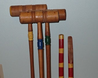 Three Croquet Mallets and Two Stakes