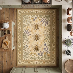 May include: Rectangular area rug with a bee and floral design. The rug features three large bees on a honeycomb background, surrounded by lavender, daisies, and other flowers. The border is a detailed floral pattern in shades of green and gold.