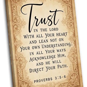 May include: A canvas print with a vintage design, displaying the word "Trust" in cursive script. The text includes a quote from Proverbs 3:5-6, set against a beige background with decorative border details.