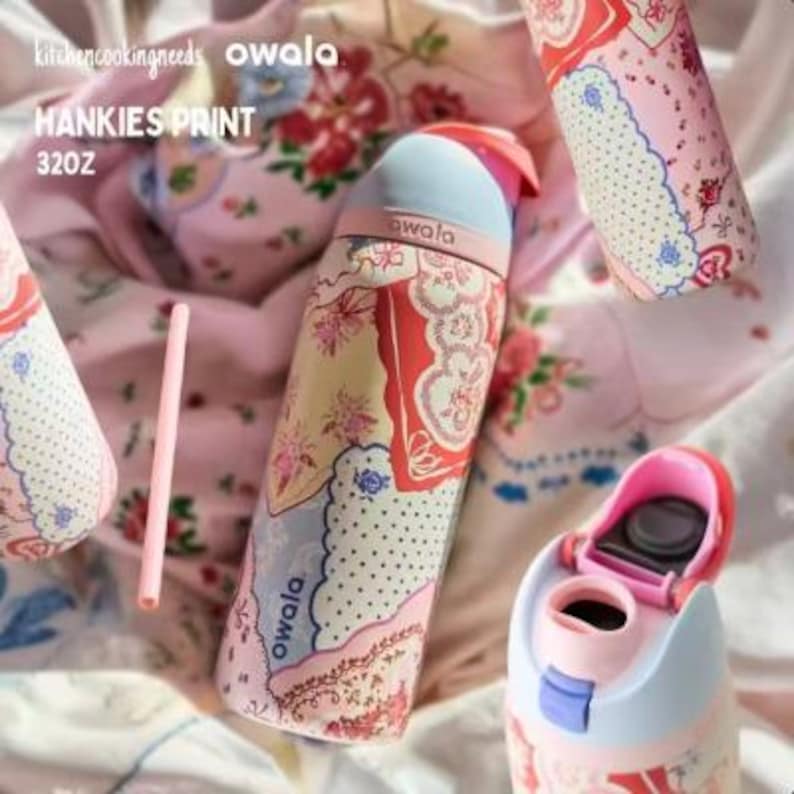 May include: Several Owala water bottles with a "Hankies Print" design are displayed. The bottles feature a mix of pink, red, and blue floral patterns. One bottle has an open lid, revealing the interior. A pink straw is also visible. The bottles are 32oz.