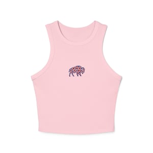 May include: A light pink crop top with a high neckline. The top features a small embroidered bison design on the front, filled with red and blue stars. The top is made of a soft, comfortable material.
