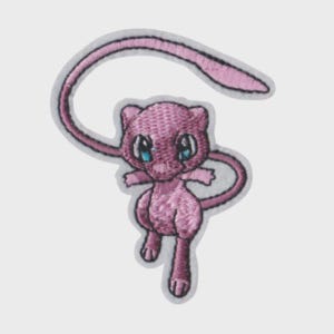 May include: An embroidered patch featuring a light pink creature with large blue eyes and a long, curved tail. The design is outlined in a white border, showcasing detailed stitching that defines the character's small limbs and rounded ears.