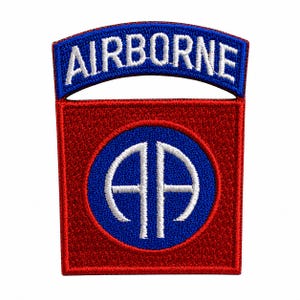 May include: An embroidered patch featuring a red square base with a blue circular center containing the white letters AA. Above the square is a blue arched tab with the word AIRBORNE stitched in white thread. The design uses red, blue, and white.