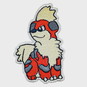 May include: An embroidered patch featuring a stylized creature with cream-colored fur on its head and chest, a bright orange body with dark gray stripes, and dark gray accents on its ears and legs, all outlined with a white stitched border.