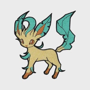 May include: An embroidered patch featuring a stylized creature with a cream-colored body, large pointed ears with teal and orange accents, and a prominent, jagged teal tail. The design includes dark brown eyes and teal tufts on the limbs.