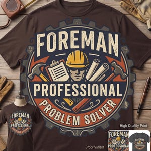 May include: A dark brown t-shirt featuring a large circular graphic with a gear border. The design includes a yellow hard hat, a clipboard, and two hammers. The text reads FOREMAN PROFESSIONAL PROBLEM SOLVER in a bold, distressed font style.