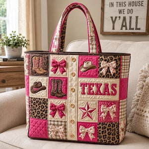 May include: A quilted tote bag with a patchwork design featuring cowboy boots, hats, bows, and the word "TEXAS". The bag has a pink, brown, and cream color scheme with a leopard print accent and a matching handle.