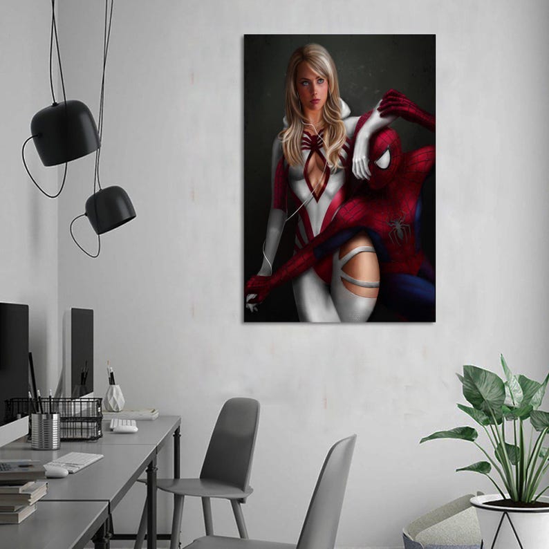 May include: A rectangular wall art print featuring a digital illustration of a blonde character in a white and red suit standing behind a red and blue costumed character with a spider emblem on the chest, both set against a dark background.