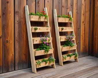 May include: Two wooden ladder planters with multiple rectangular boxes filled with various green plants and colorful flowers. The planters are leaning against a wooden wall, creating a vertical garden display. The wood has a natural finish.