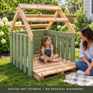 May include: A wooden playhouse structure featuring sage green vertical wall slats and a natural light-colored wood frame with an open roof design. The base consists of horizontal wooden planks, creating a platform for play in an outdoor setting.