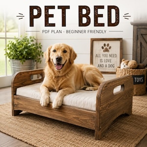 May include: A wooden pet bed with a light-colored cushion and cut-out handles on the sides. The text PET BED PDF PLAN - BEGINNER FRIENDLY is visible at the top. A golden retriever is lying on the bed, which is placed on a woven rug.