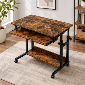May include: A mobile computer desk featuring a rectangular top and a sliding keyboard tray, both finished in a dark brown wood grain pattern. The desk is supported by a black metal frame with adjustable height knobs and four small caster wheels.