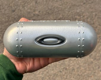 Estuche metálico para gafas de sol Oakley, estuche rígido de aluminio tipo torpedo con carcasa tipo concha.