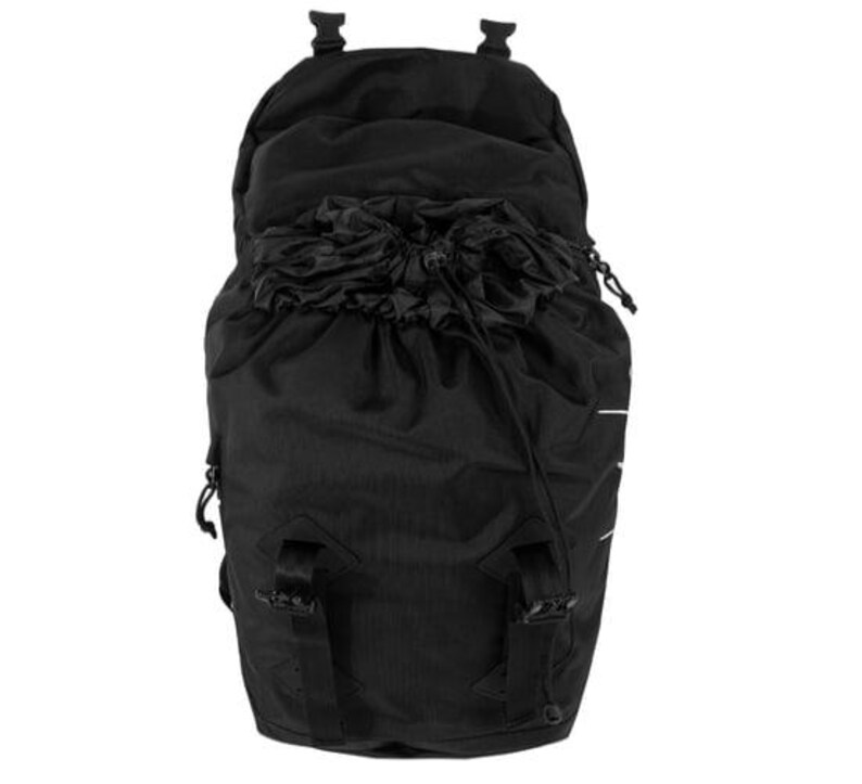 May include: Black backpack with a drawstring closure and adjustable straps. The backpack has a top flap with two buckles and a drawstring closure. The bag is made of a durable, textured material and features white accent stripes.