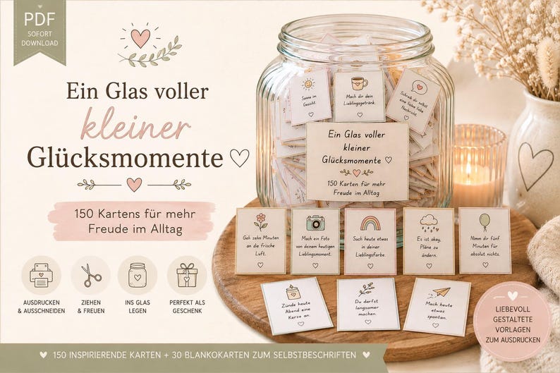 Puede incluir: Un frasco de vidrio lleno de peque&ntilde;as tarjetas, cada una con una ilustraci&oacute;n &uacute;nica y texto en alem&aacute;n. La etiqueta del frasco dice "Ein Glas voller kleiner Gl&uuml;cksmomente" con 150 tarjetas para la alegr&iacute;a diaria. Varias tarjetas individuales est&aacute;n frente al frasco.