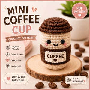 May include: A crochet pattern for a mini coffee cup featuring a cream-colored body, a dark brown lid, and a dark brown sleeve with the text COFFEE. The design includes black safety eyes, a stitched smile, and pink cheeks on a cream background.