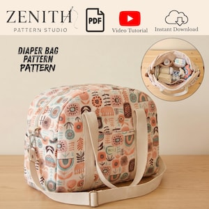 May include: A diaper bag pattern from Zenith Pattern Studio featuring a cream fabric with a multi-colored floral and rainbow print. The bag has two cream handles and an adjustable shoulder strap. An inset shows the bag interior with organized items.