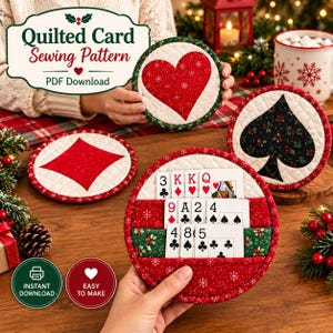 May include: Four circular quilted card holders featuring red and black fabric with holiday patterns. One holder displays a red heart, one a red diamond, one a black spade, and one holds playing cards. Text reads Quilted Card Sewing Pattern.