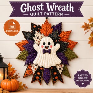May include: A Ghost Wreath quilt pattern PDF download featuring a central white ghost with a purple bowtie surrounded by quilted fabric leaves in orange, black, purple, and cream with pumpkin and spiderweb prints and easy to follow instructions.