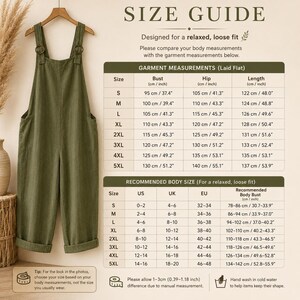 May include: An olive green jumpsuit with wide legs and shoulder straps hanging on a wooden hanger, accompanied by a size guide chart displaying measurements in centimeters and inches for sizes S through 5XL, including bust, hip, and length details.