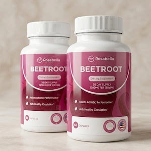 May include: Two white Rosabella Beetroot dietary supplement bottles. Each bottle has a white cap and a pink label with the text "BEETROOT", "Dietary Supplement", and "30 DAY SUPPLY 1300MG PER SERVING". The bottles also state they assist athletic performance and aid healthy circulation.