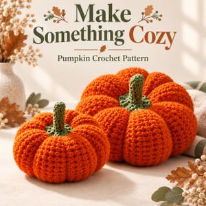 May include: Two handmade orange crochet pumpkins with green stems. The text "Make Something Cozy" and "Pumpkin Crochet Pattern" is displayed above the pumpkins. The pumpkins have a textured, ribbed appearance and are arranged on a light surface.