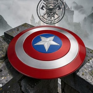 May include: A circular shield featuring a metallic red outer ring, a silver middle ring, and a blue center circle with a prominent silver five-pointed star. Above the shield, a circular logo displays the text VELORA FORGED KNIVES AXES SWORDS.