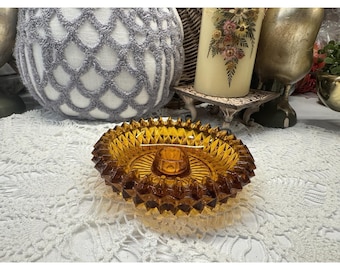 Amber glass candleholder with Diamond Point pattern by Indiana Glass.