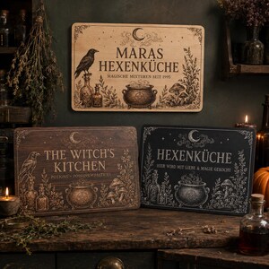 May include: Three rectangular wooden signs featuring engraved illustrations of a raven, potion bottles, a cauldron, and mushrooms. The top sign reads MARAS HEXENKÜCHE, the bottom left reads THE WITCH'S KITCHEN, and the bottom right reads HEXENKÜCHE.