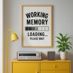May include: A rectangular wall art print in a light wood frame featuring the black text WORKING MEMORY LOADING... PLEASE WAIT and a horizontal loading bar graphic with four filled segments on a white background, displayed in a room setting.