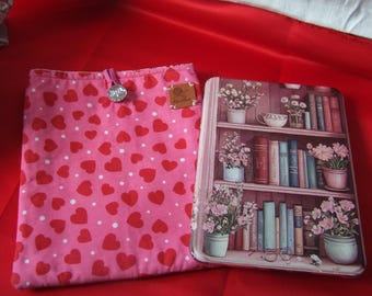 A charming handmade set featuring a pink heart kindle sleeve