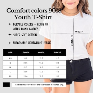 May include: White Comfort Colors 9018 Youth T-Shirt. The image includes a size chart with measurements in inches: XS (length 18.8, width 13.5, sleeve 11.5), S (length 20.5, width 14.5, sleeve 12.5), M (length 21.5, width 16.5, sleeve 13.8), L (length 22.8, width 17.5, sleeve 14.5), and XL (length 26.0, width 19.5, sleeve 15.8).