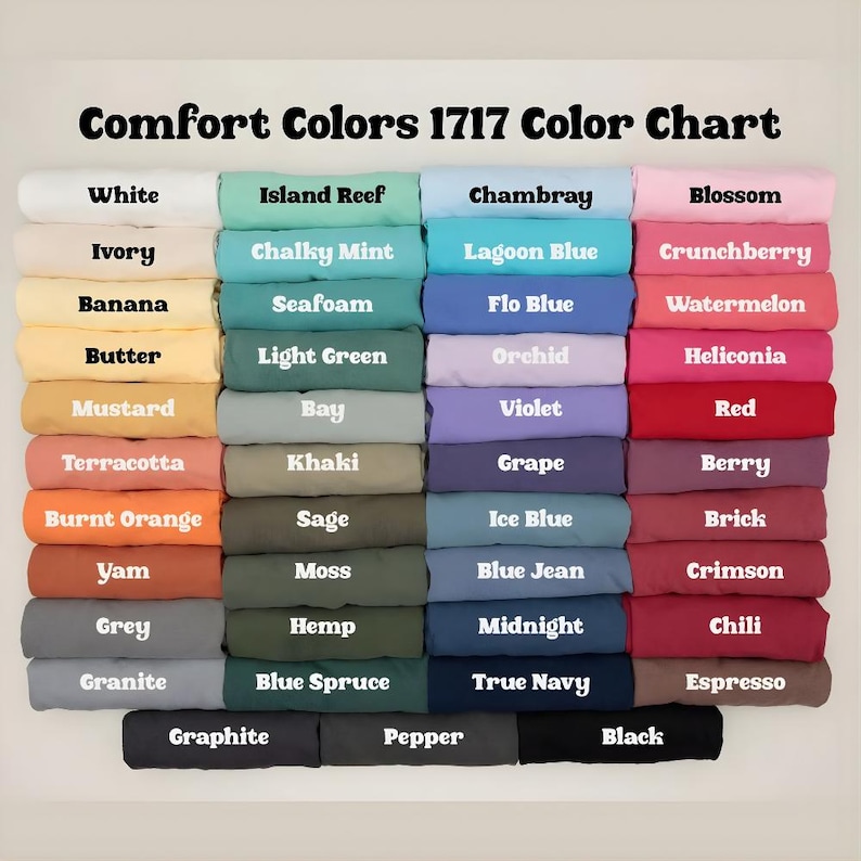 May include: A color chart titled "Comfort Colors 1717 Color Chart" displays a variety of fabric colors. The chart includes shades like white, ivory, banana, butter, mustard, terracotta, burnt orange, yam, grey, and granite. Other colors include island reef, chalky mint, seafoam, light green, bay, khaki, sage, and moss.