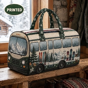 May include: A quilted duffel bag shaped like a bus with a winter mountain scene print. The bag features dark green handles with white snowflake patterns, a windshield, wheels, and side windows. The design includes snow-covered trees, skis, and mountains.