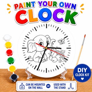 May include: A DIY clock kit with the text "PAINT YOUR OWN CLOCK". The white clock face features a cartoon elephant, fruit, and a butterfly. Includes paint pots, a paintbrush, and a stand. The clock can be mounted on the wall or used with the stand.
